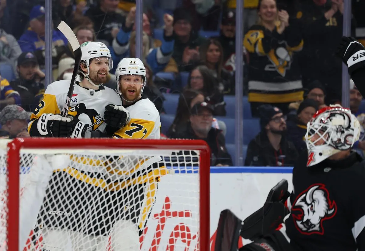 Pittsburgh Penguins center Tommy Novak (18) reacts after scoring goal during the third period against the Buffalo Sabres at KeyBank Center.