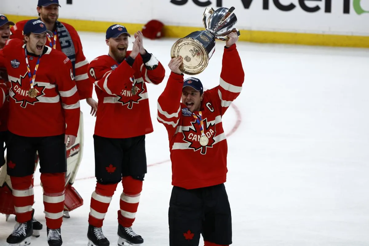 [Imagn Images direct customers only] Team Canada forward Sidney Crosby (87) lifts the 4 Nations Face-Off trophy after winning against Team USA in overtime during the 4 Nations Face-Off ice hockey championship game at TD Garden.