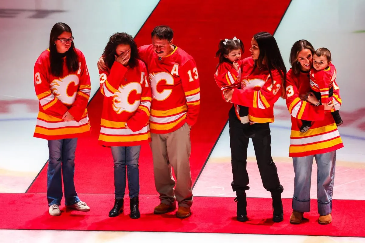 Johnny Gaudreau#8217;s family during ceremonial puck drop by Columbus Blue Jackets center Sean Monahan (23) and Calgary Flames center Mikael Backlund (11) prior to the game between the Calgary Flames and the Columbus Blue Jackets at Scotiabank Saddledome.