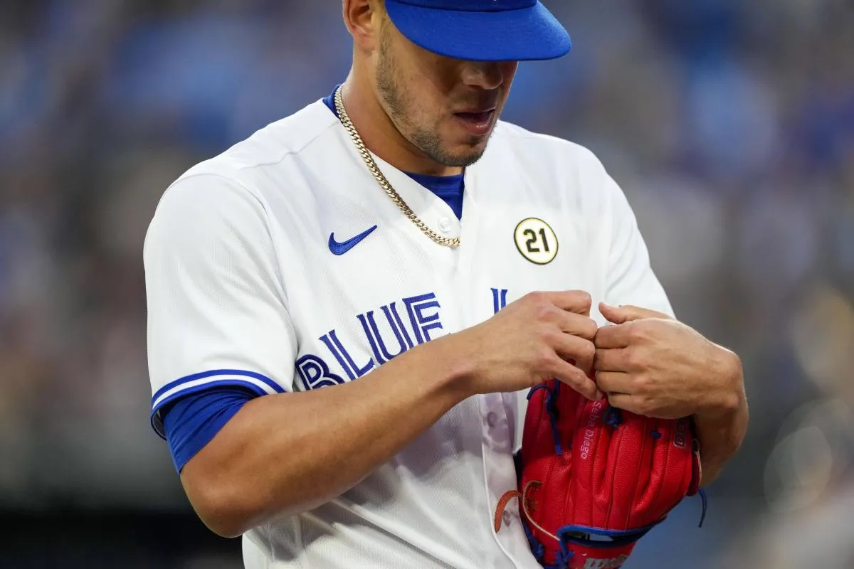Toronto Blue Jays starting pitcher Jose Berrios (17) wears a number twenty-one patch on his jersey to celebrate Roberto Clemente Day at an MLB game against the Boston Red Sox at Rogers Centre.