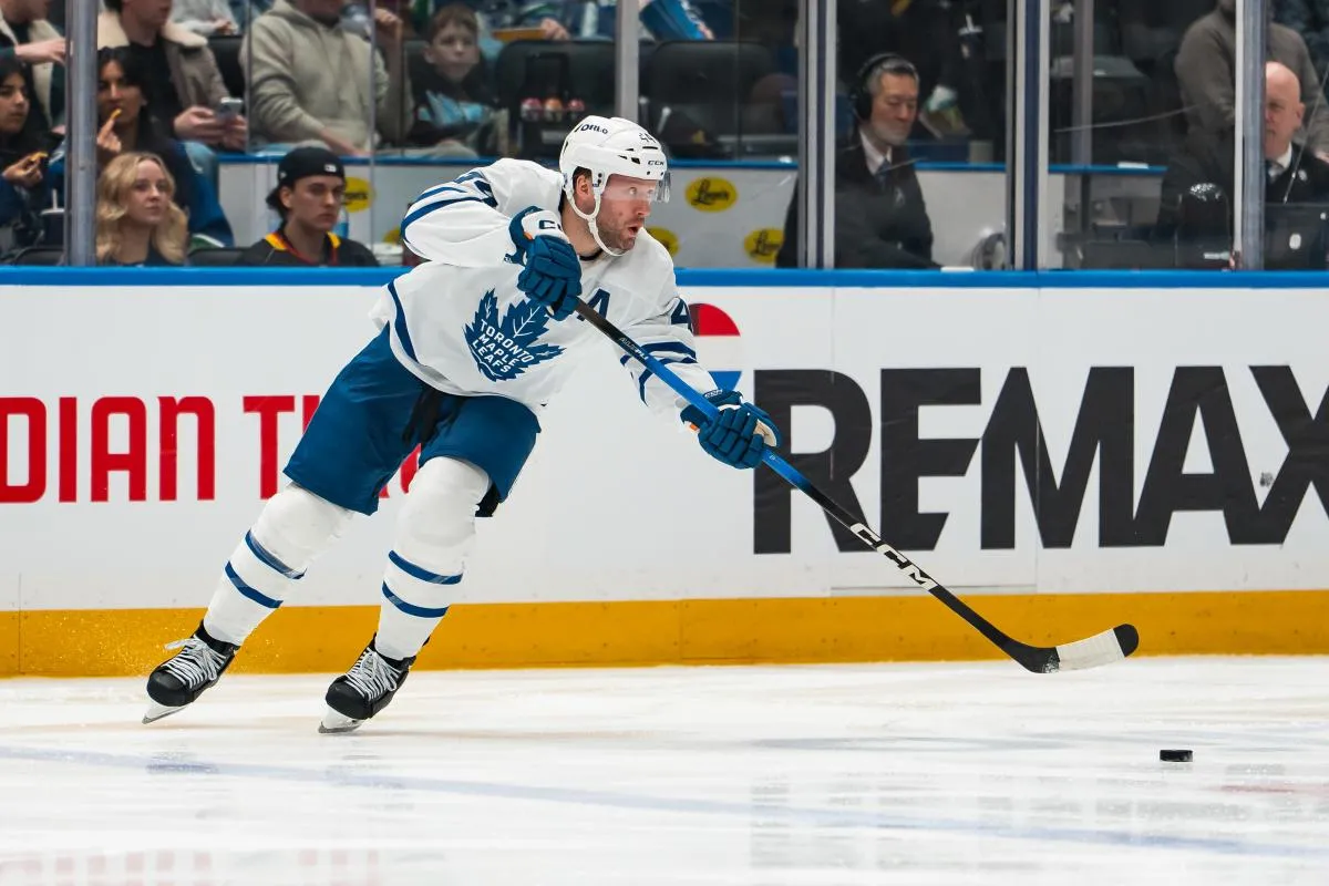 Toronto Maple Leafs defenseman Morgan Rielly (44) makes a pass against the Vancouver Canucks in the second period at Rogers Arena.
