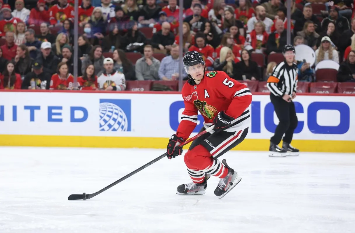 Chicago Blackhawks defenseman Connor Murphy (5) skates with the puck during the second period against the San Jose Sharks at United Center.