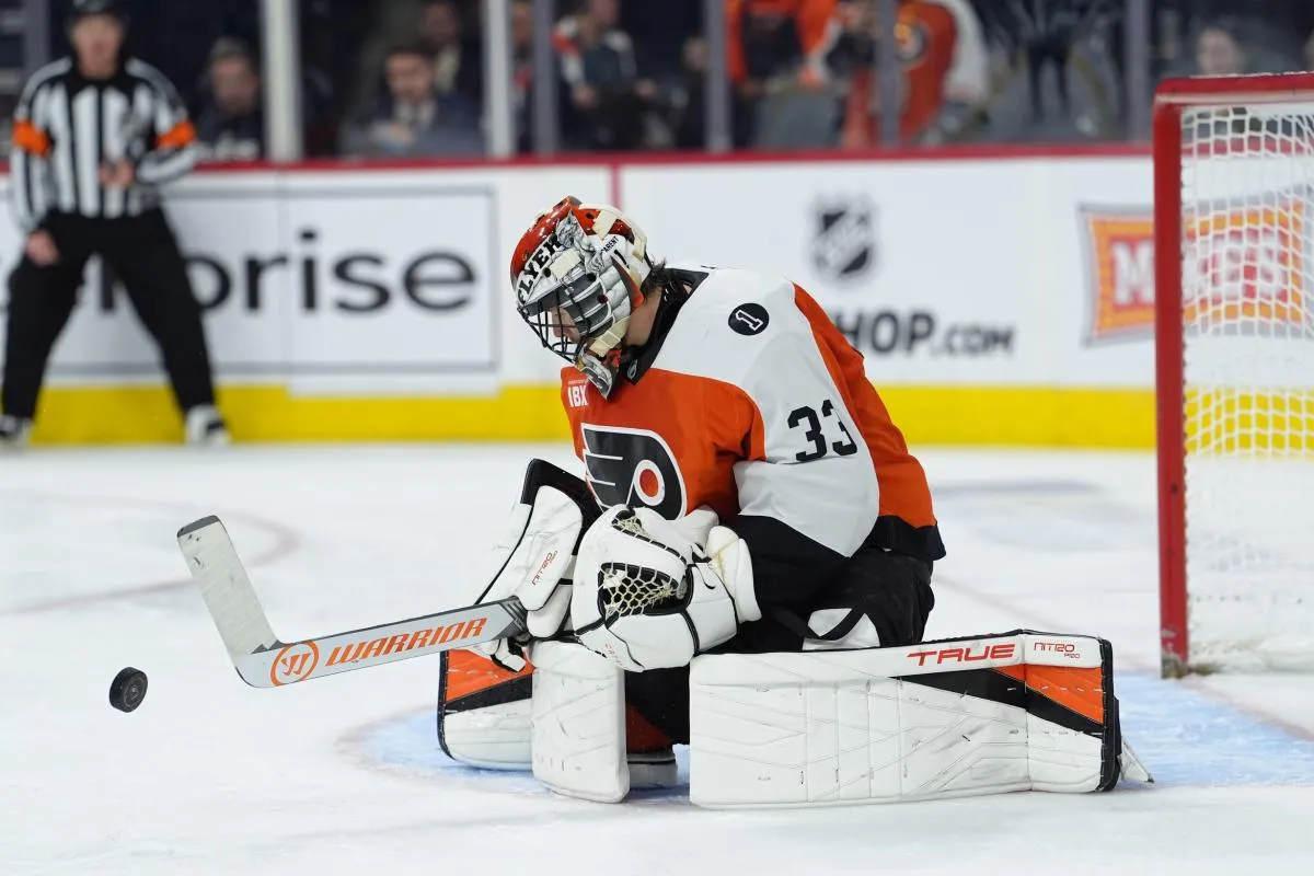 Philadelphia Flyers goalie Samuel Ersson (33) makes a save against the New York Islanders in the second period at Xfinity Mobile Arena.