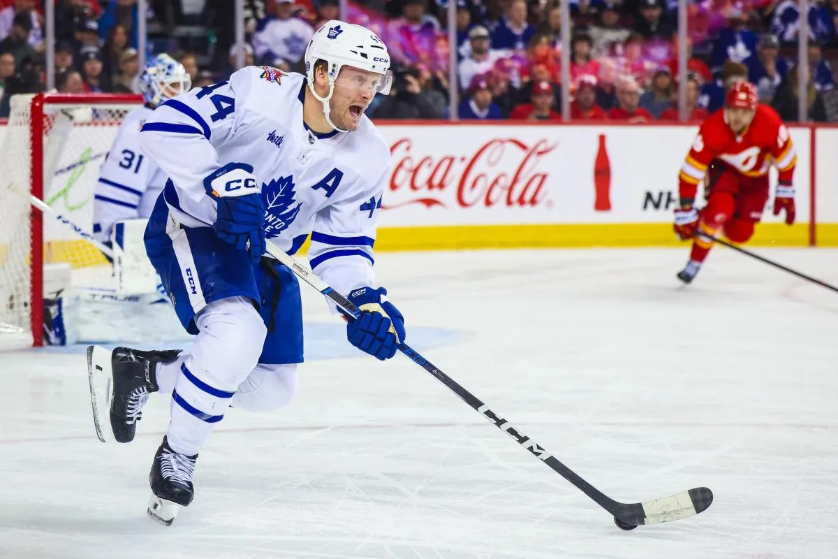 Toronto Maple Leafs defenseman Morgan Rielly (44) controls the puck against the Calgary Flames during the second period at Scotiabank Saddledome.