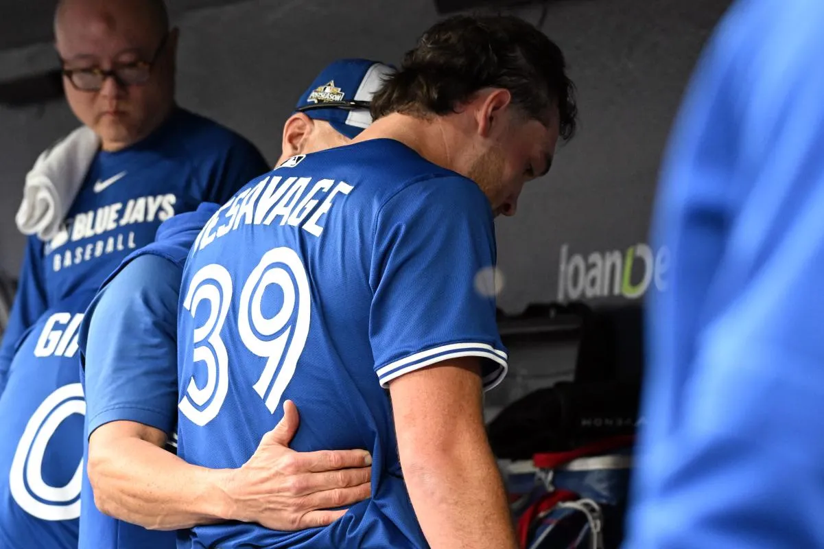 Toronto Blue Jays pitching coach Pete Walker (41) talks with pitcher Trey Yesavage (39) in the dugout in the first inning against the Seattle Mariners during game two of the ALCS round for the 2025 MLB playoffs at Rogers Centre.