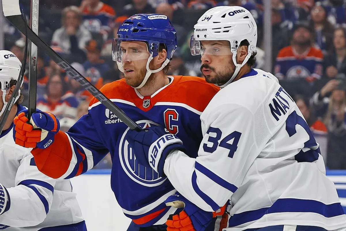Edmonton Oilers forward Connor McDavid (97) and Toronto Maple Leafs forward Auston Matthews (34) battle for position during the first period at Rogers Place