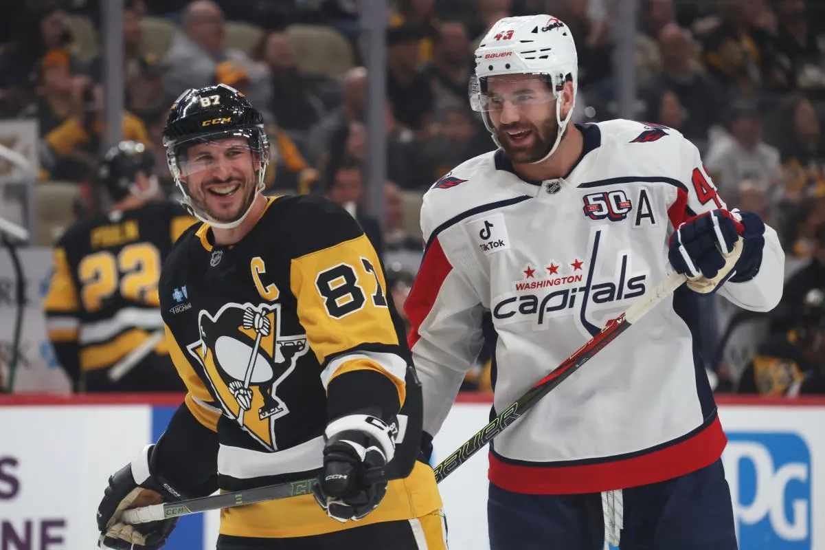 Washington Capitals right wing Tom Wilson (43) and Pittsburgh Penguins center Sidney Crosby (87) share a laugh during the first period at PPG Paints Arena.