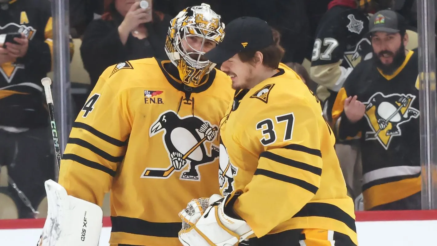 Pittsburgh Penguins goaltenders Stuart Skinner (74) and Arturs Silovs (37) react after defeating the Philadelphia Flyers at PPG Paints Arena.