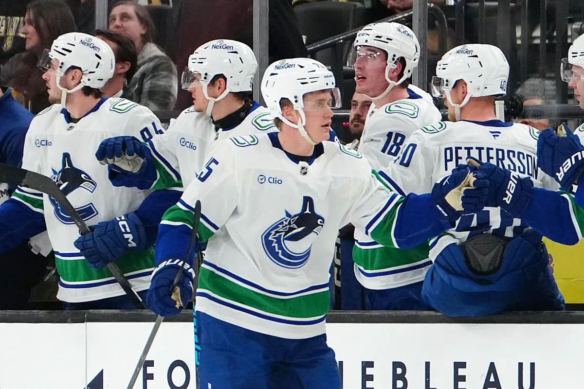 Vancouver Canucks defenseman Elias Pettersson (25) celebrates after scoring a goal against the Vegas Golden Knights during the second period at T-Mobile Arena.
