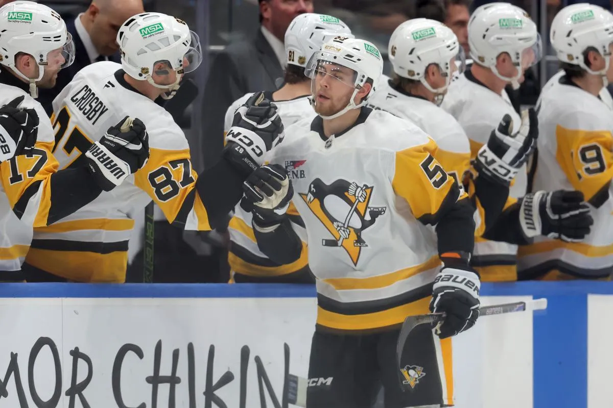 Pittsburgh Penguins right wing Egor Chinakhov (59) celebrates his goal against the New York Islanders with teammates during the second period at UBS Arena.