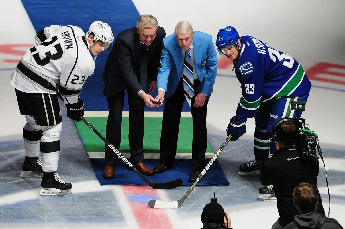 Sports broadcasters for CBC Jim Hughson and Jim Robson are honored during the first period as the Vancouver Canucks host the Los Angeles Kings at Rogers Arena.