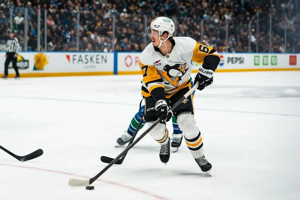 Pittsburgh Penguins forward Rickard Rakell (67) handles the puck against the Vancouver Canucks in the first period at Rogers Arena.
