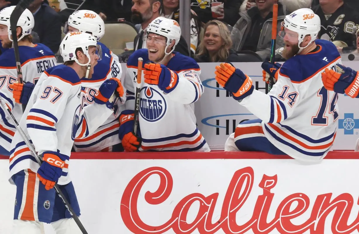 Edmonton Oilers center Connor McDavid (97) celebrates his goal with the Oilers bench against the Pittsburgh Penguins during the first period at PPG Paints Arena.