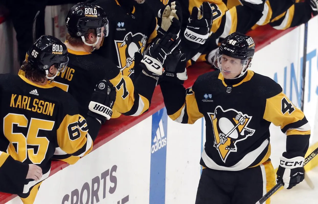 Pittsburgh Penguins right wing Valtteri Puustinen (48) celebrates his goal with the Pens bench against the New York Rangers during the third period at PPG Paints Arena. New York won 7-4.