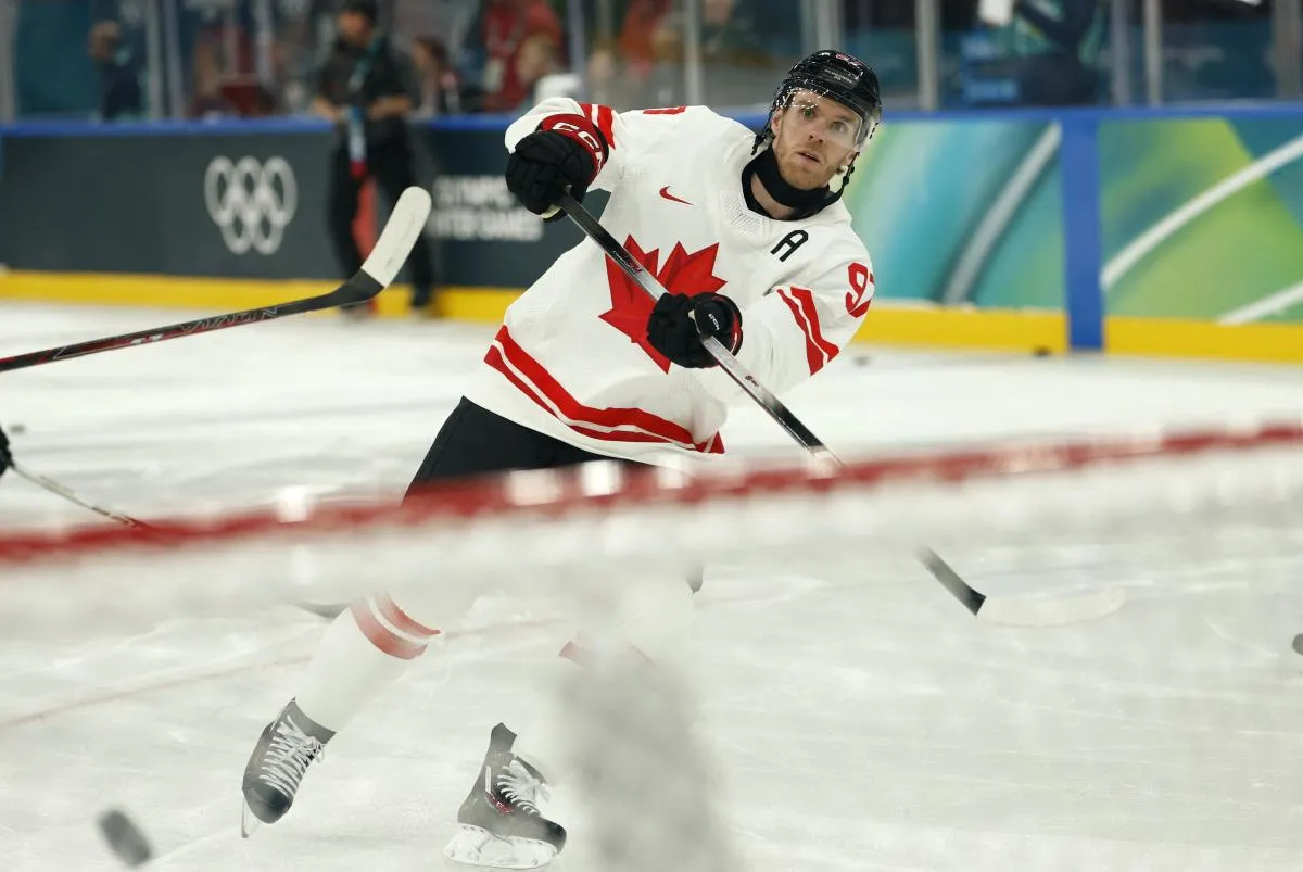 Connor McDavid of Canada during the warm up before the match against Czechia in a men's ice hockey group A match during the Milano Cortina 2026 Olympic Winter Games at Milano Santagiulia Ice Hockey Arena.