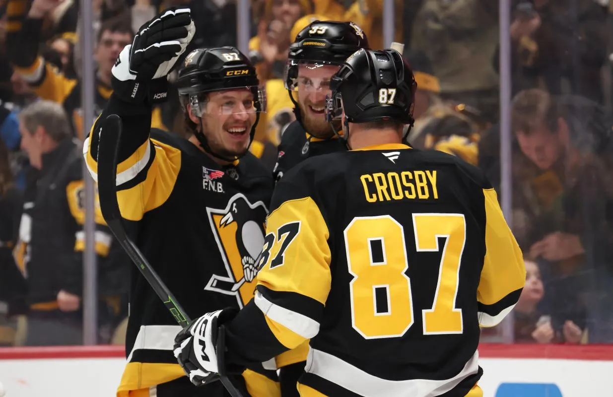 Pittsburgh Penguins right wing Rickard Rakell (left) celebrates his goal with right wing Anthony Mantha (39) and center Sidney Crosby (87) against the New York Rangers during the third period at PPG Paints Arena.