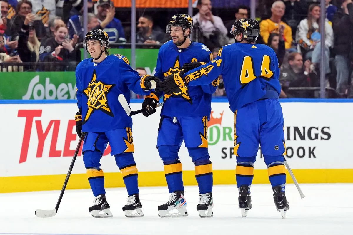 Team Matthews right wing Clayton Keller (9) of the Arizona Coyotes, Team Matthews center Auston Matthews (34) of the Toronto Maple Leafs and Team Matthews defenseman Morgan Rielly (44) of the Toronto Maple Leafs celebrates winning the 2024 NHL All-Star Game at Scotiabank Arena