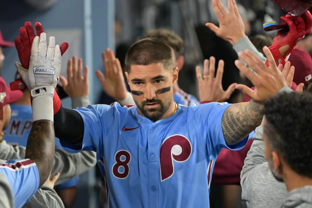 Philadelphia Phillies right fielder Nick Castellanos (8) celebrates after scoring a run during the eighth inning against the Los Angeles Dodgers during game three of the NLDS round for the 2025 MLB playoffs at Dodger Stadium.