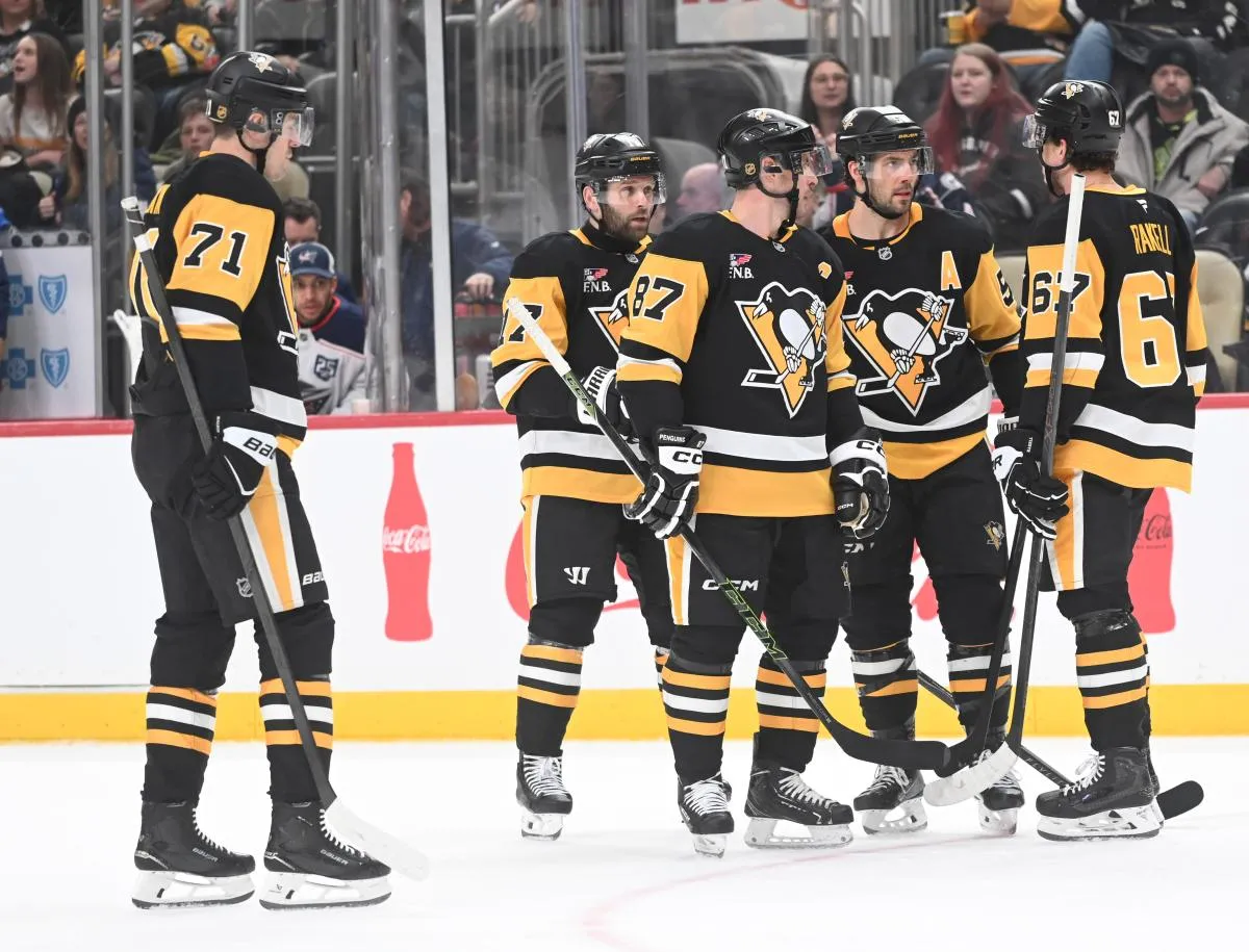 Pittsburgh Penguins center Evgeni Malkin (71) and right wing Bryan Rust (17) and center Sidney Crosby (87) and defenseman Kris Letang (58) and right wing Rickard Rakell (67) gather for a power play against the Columbus Blue Jackets at PPG Paints Arena.