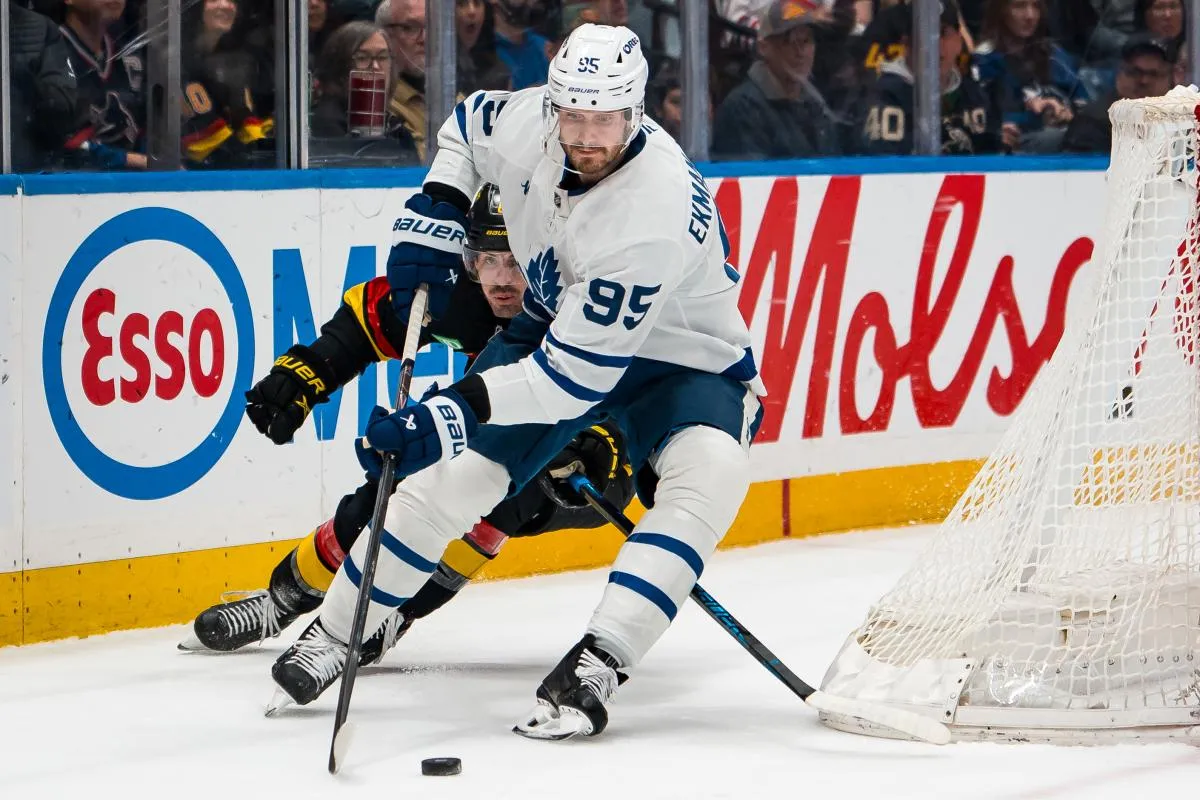 Vancouver Canucks forward Conor Garland (8) pursues Toronto Maple Leafs defenseman Oliver Ekman-Larsson (95) in the second period at Rogers Arena.