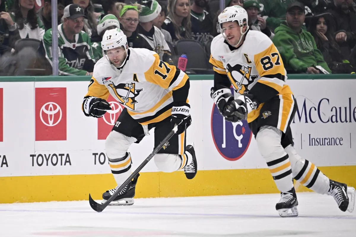 Pittsburgh Penguins right wing Bryan Rust (17) and center Sidney Crosby (87) skates against the Dallas Stars during the first period at American Airlines Center.