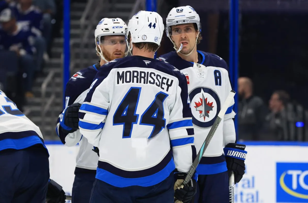 Winnipeg Jets defenseman Josh Morrissey (44) and center Mark Scheifele (55) and left wing Kyle Connor (81) talk against the Tampa Bay Lightning during the first period at Benchmark International Arena.