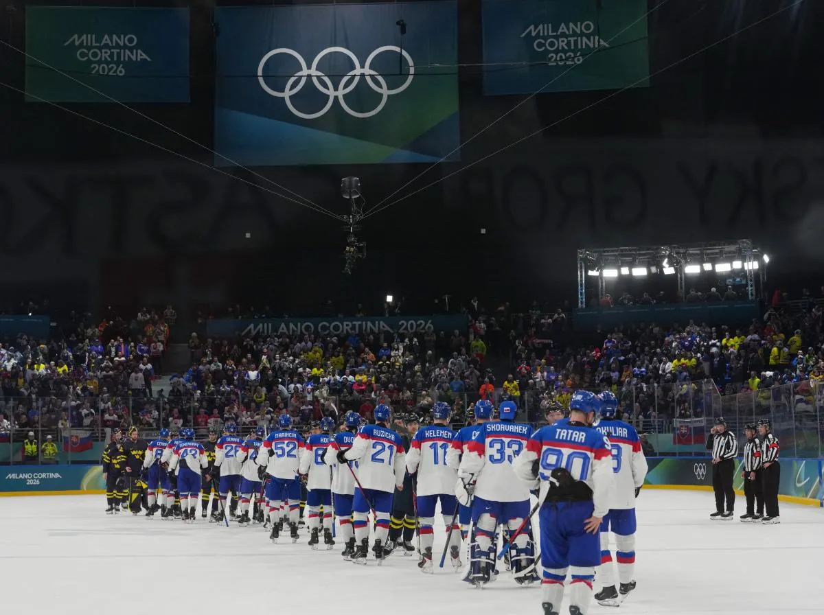 General view as Sweden and Slovakia players shake hands after a Group B men's ice hockey game during the Milano Cortina 2026 Olympic Winter Games at Milano Santagiulia Ice Hockey Arena.