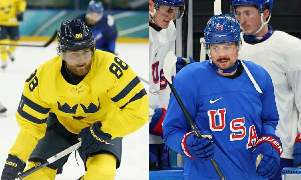William Nylander of Sweden in action with Jason Seed of Italy in men's ice hockey group B play during the Milano Cortina 2026 Olympic Winter Games at Milano Santagiulia Ice Hockey Arena