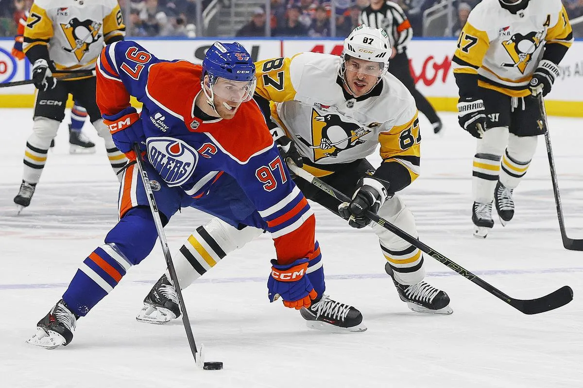 Pittsburgh Penguins forward Sidney Crosby (87) chases Edmonton Oilers forward Connor McDavid (97) up the ice during the first period at Rogers Place.