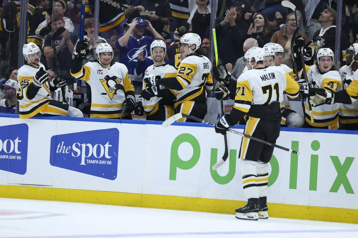 Pittsburgh Penguins center Evgeni Malkin (71) celebrates after scoring a goal against the Tampa Bay Lightning in the second period at Benchmark International Arena.