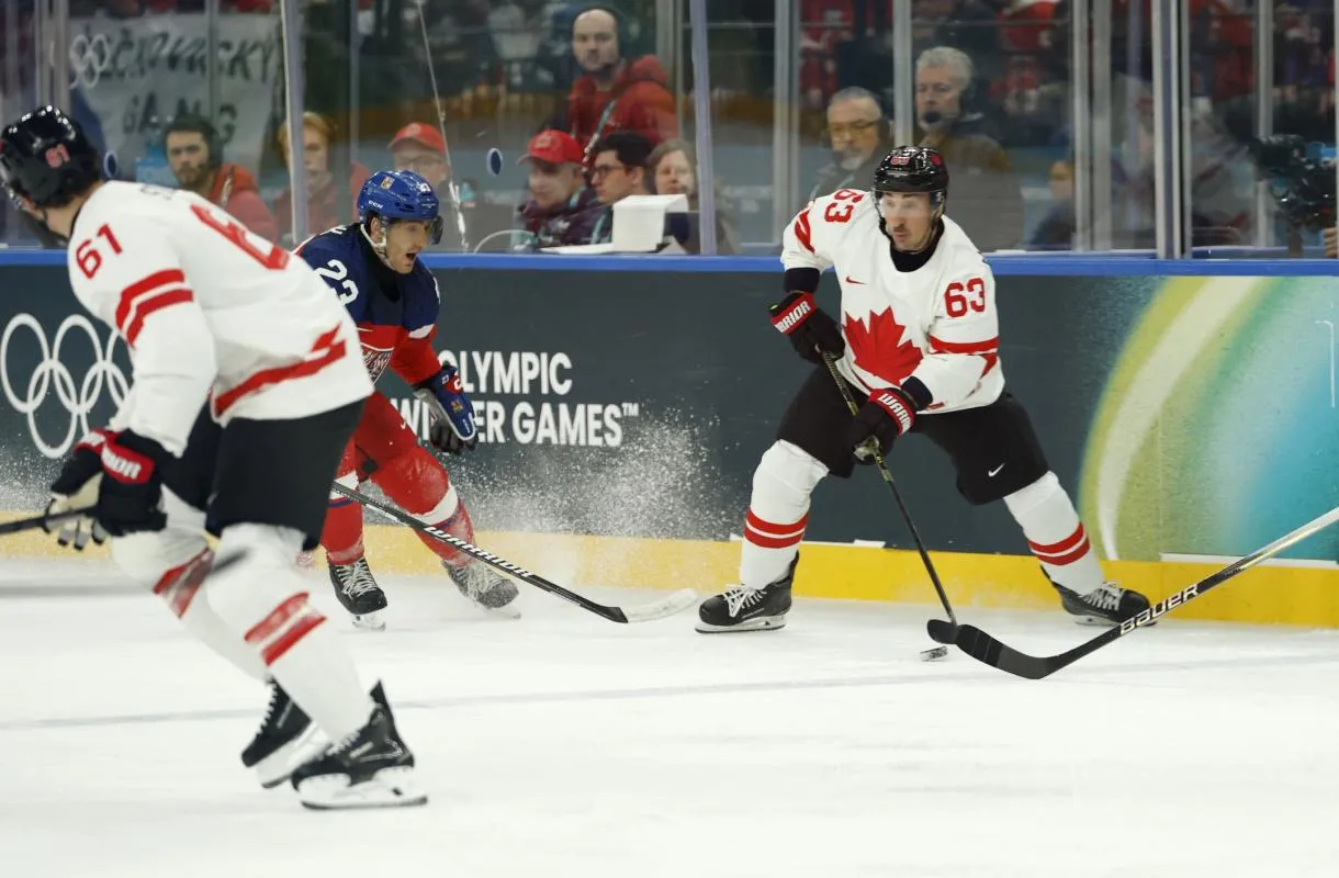 Brad Marchand of Canada in action with Lukas Sedlak of Czechia in a men's ice hockey group A match during the Milano Cortina 2026 Olympic Winter Games at Milano Santagiulia Ice Hockey Arena.