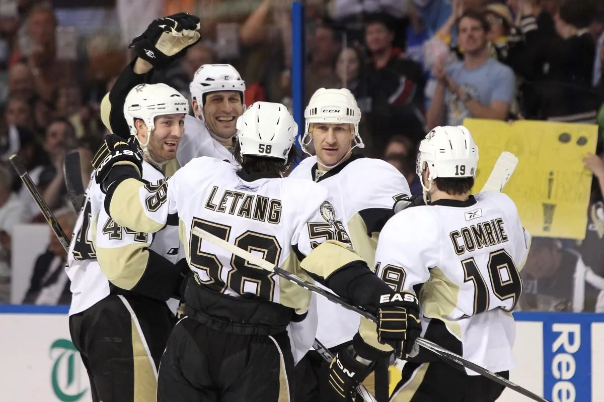 Pittsburgh Penguins left wing Mike Rupp (17) scoared a goal and celebrates with defenseman Brooks Orpik (44), right wing Alexei Kovalev (72), defenseman Kris Letang (58) and center Mike Comrie (19) during the third period against the Tampa Bay Lightning at St. Pete Times Forum. The Lightning won 2-1.