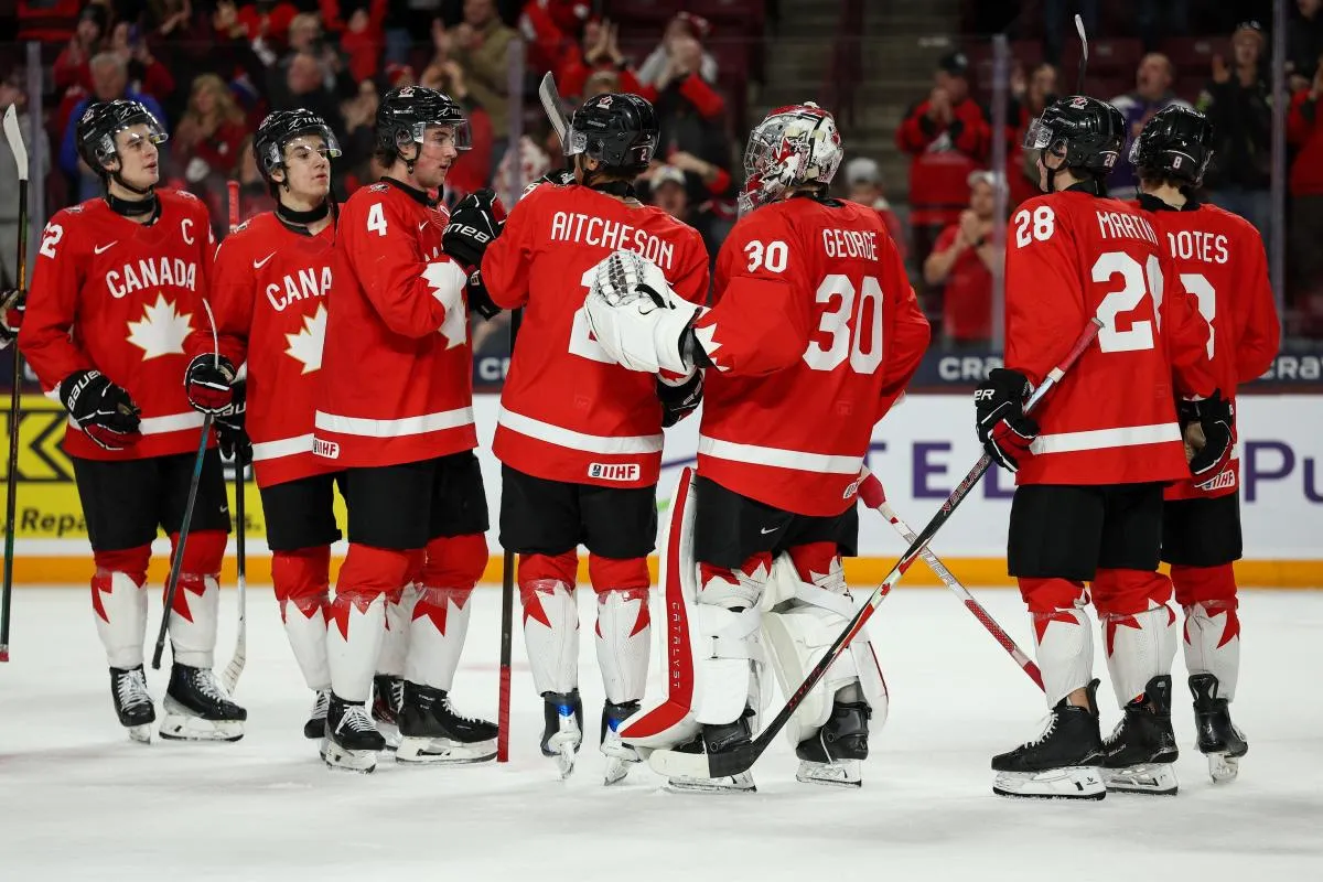 Canada players celebrate their teams win against Finland during the third period in group play during the 2026 IIHF World Junior Championship at 3M Arena.