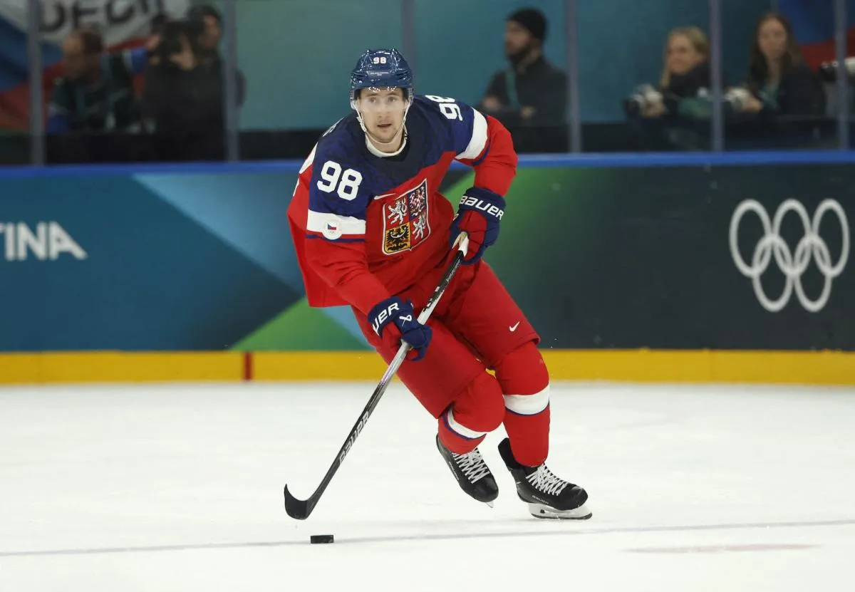 Martin Necas of Czechia in action against Canada in a men's ice hockey group A match during the Milano Cortina 2026 Olympic Winter Games at Milano Santagiulia Ice Hockey Arena.