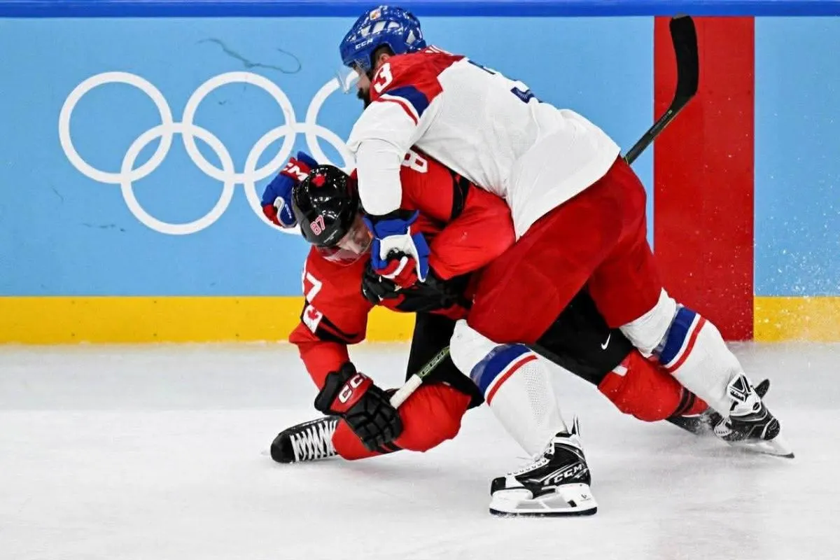 Radko Gudas of Team Czechia finishing a check on Sidney Crosby of Team Canada that would lead to an injury for Crosby.