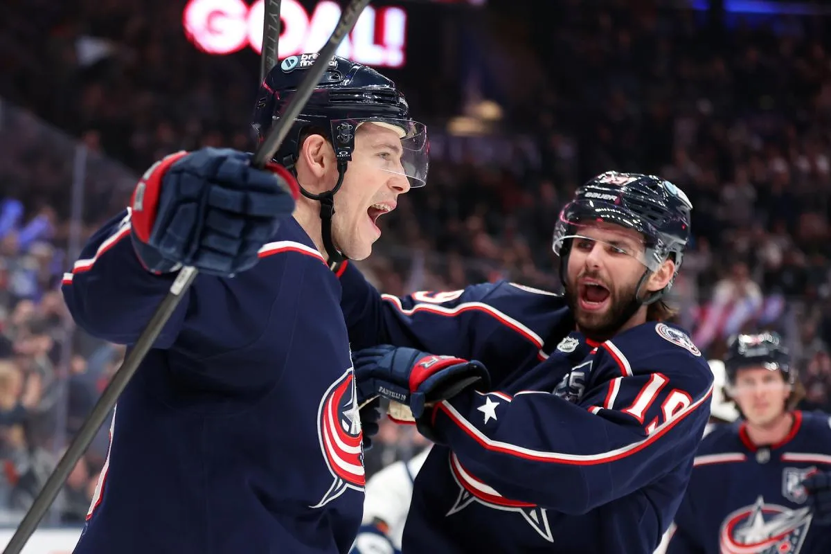 Charlie Coyle celebrates a goal with Blue Jackets teammate Adam Fantilli