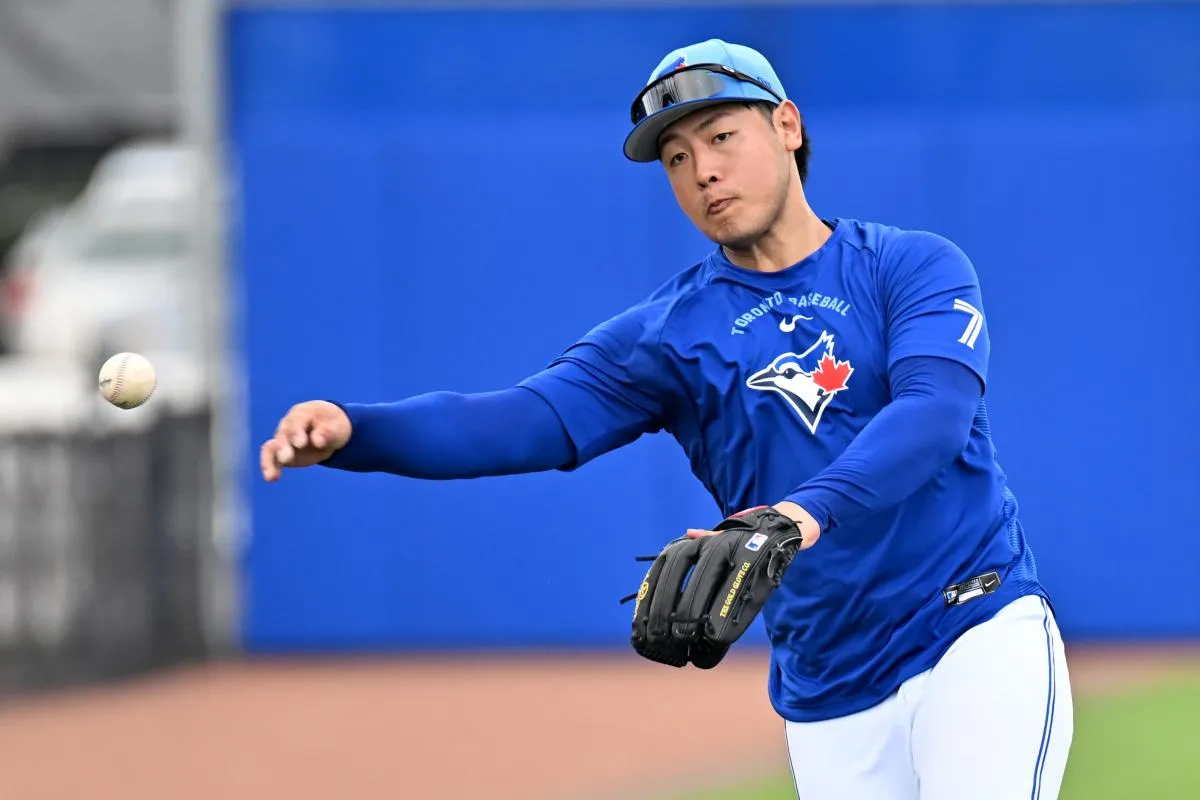 Dunedin, FL, USA;] Toronto Blue Jays infielder Kazuma Okamoto (7) throws to home plate during spring training at Bobby Mattick Training Center at Englebert Complex.