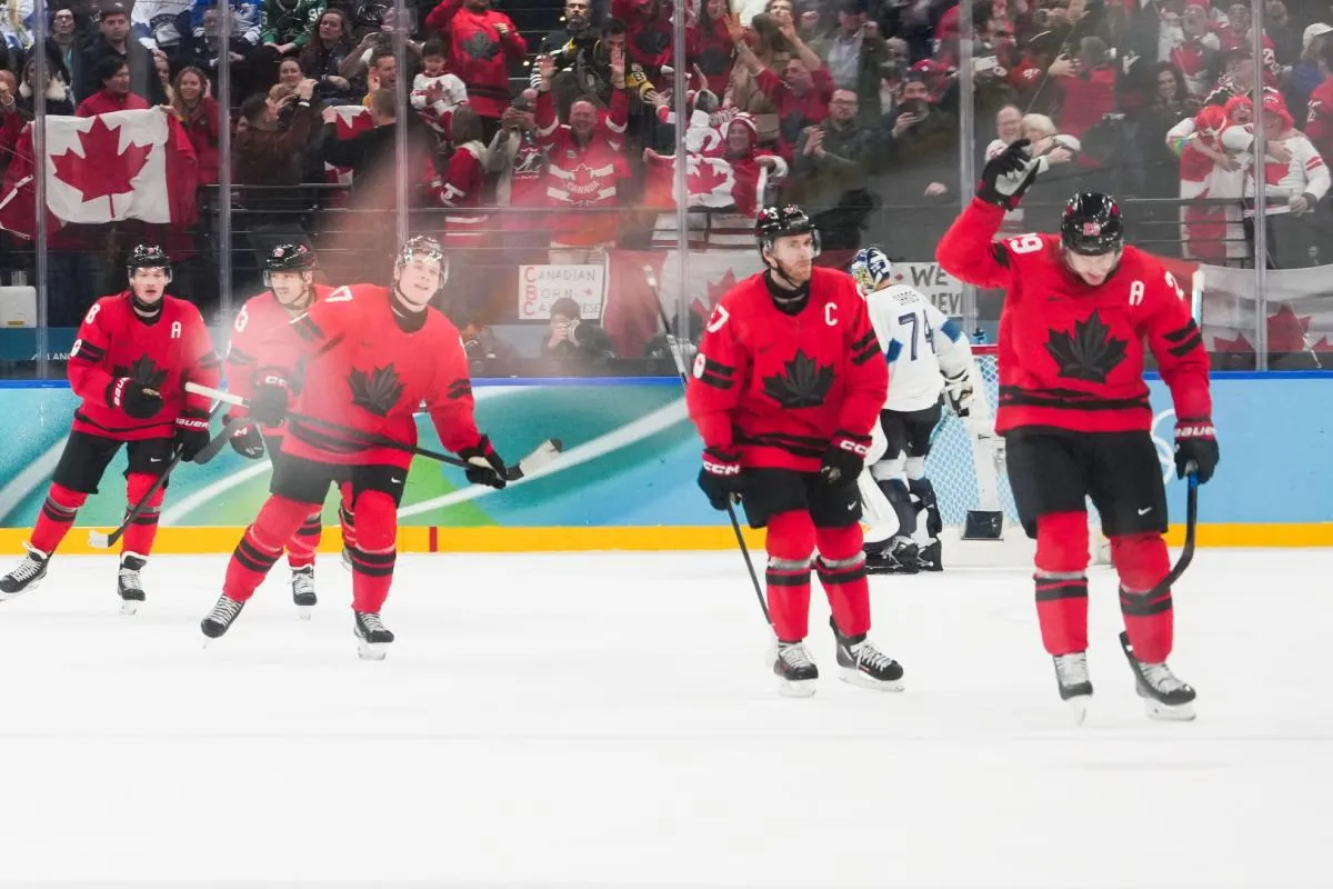 Nathan MacKinnon (29) of Canada celebrates after scoring a goal during the third period against Finland in a men's ice hockey semifinal during the Milano Cortina 2026 Olympic Winter Games at Milano Santagiulia Ice Hockey Arena.