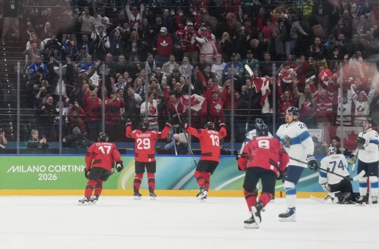Nathan MacKinnon (29) of Canada celebrates after scoring a goal during the third period against Finland in a men's ice hockey semifinal during the Milano Cortina 2026 Olympic Winter Games at Milano Santagiulia Ice Hockey Arena.