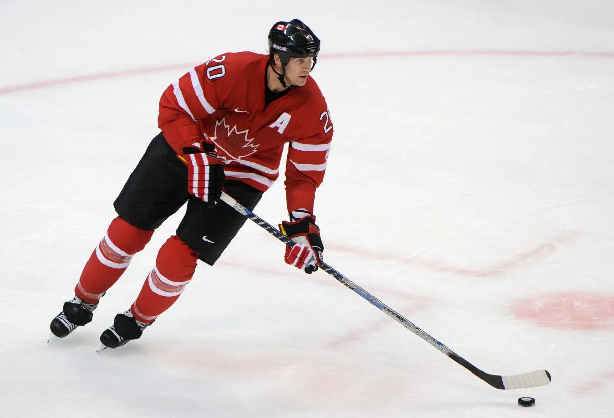Canada defenseman Chris Pronger (20) controls the puck in the second period against Norway during the preliminary round of group A play of the 2010 Vancouver Olympics at the Canada Hockey Place. Canada defeated Norway 8-0.