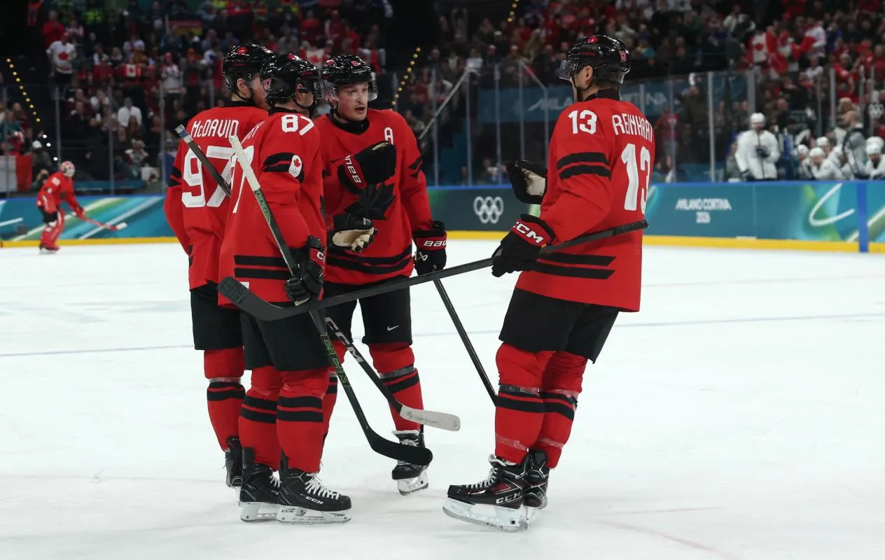 Cale Makar of Canada, Sidney Crosby of Canada, Connor McDavid of Canada and Sam Reinhart of Canada react against France in men's ice hockey group A play during the Milano Cortina 2026 Olympic Winter Games at Milano Santagiulia Ice Hockey Arena.