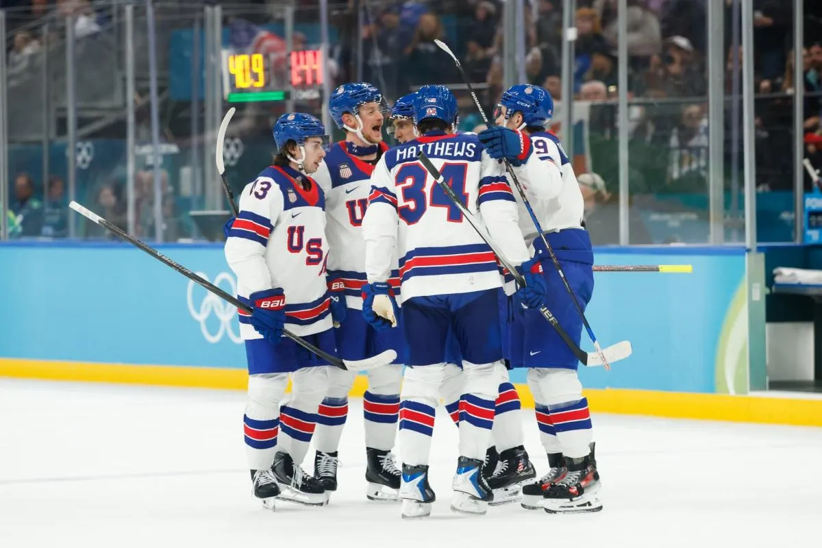 The United States celebrate after Tage Thompson (72) of the United States scores a goal during the first period against Slovakia in a men's ice hockey semifinal during the Milano Cortina 2026 Olympic Winter Games at Milano Santagiulia Ice Hockey Arena.