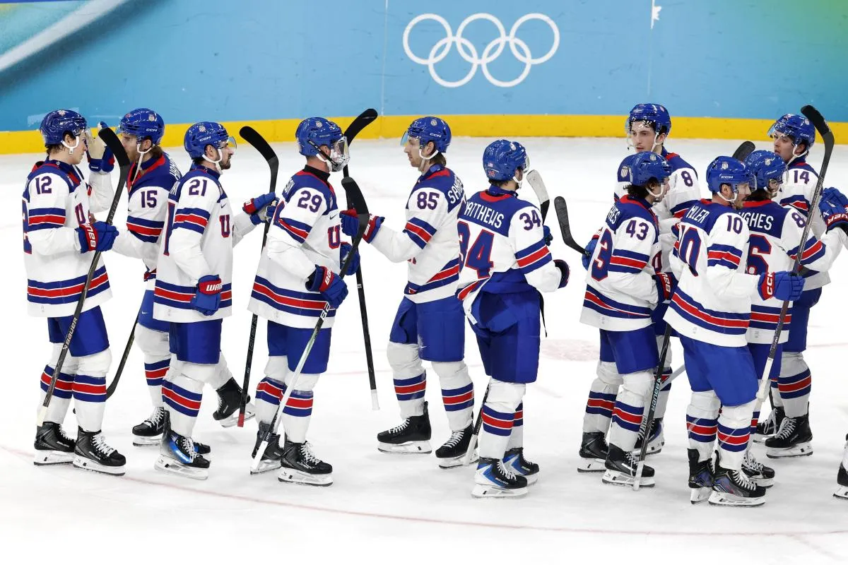 United States players celebrate after defeating Slovakia in a men's ice hockey semifinal during the Milano Cortina 2026 Olympic Winter Games at Milano Santagiulia Ice Hockey Arena.