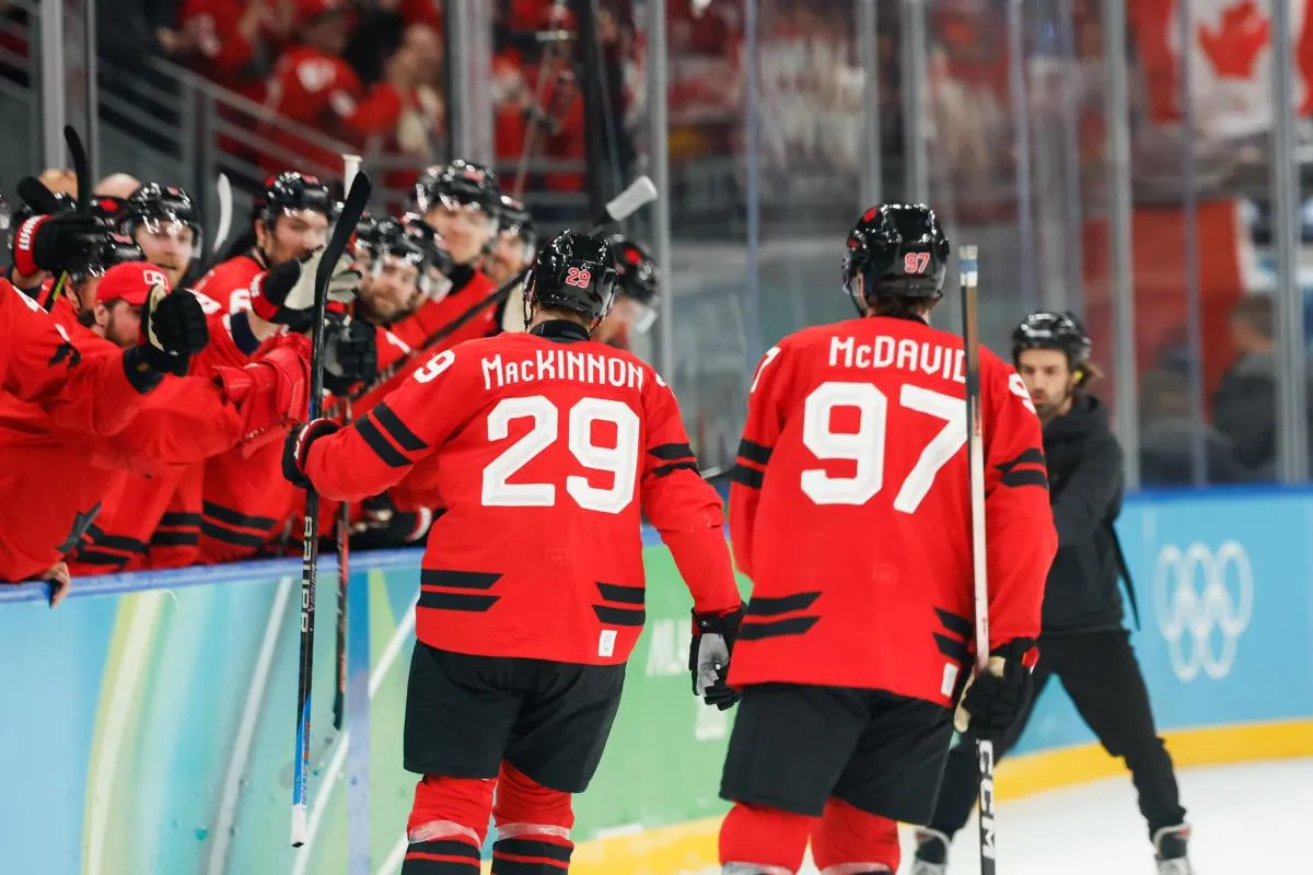 Nathan MacKinnon (29) of Canada celebrates after scoring a goal during the third period against Finland in a men's ice hockey semifinal during the Milano Cortina 2026 Olympic Winter Games at Milano Santagiulia Ice Hockey Arena.