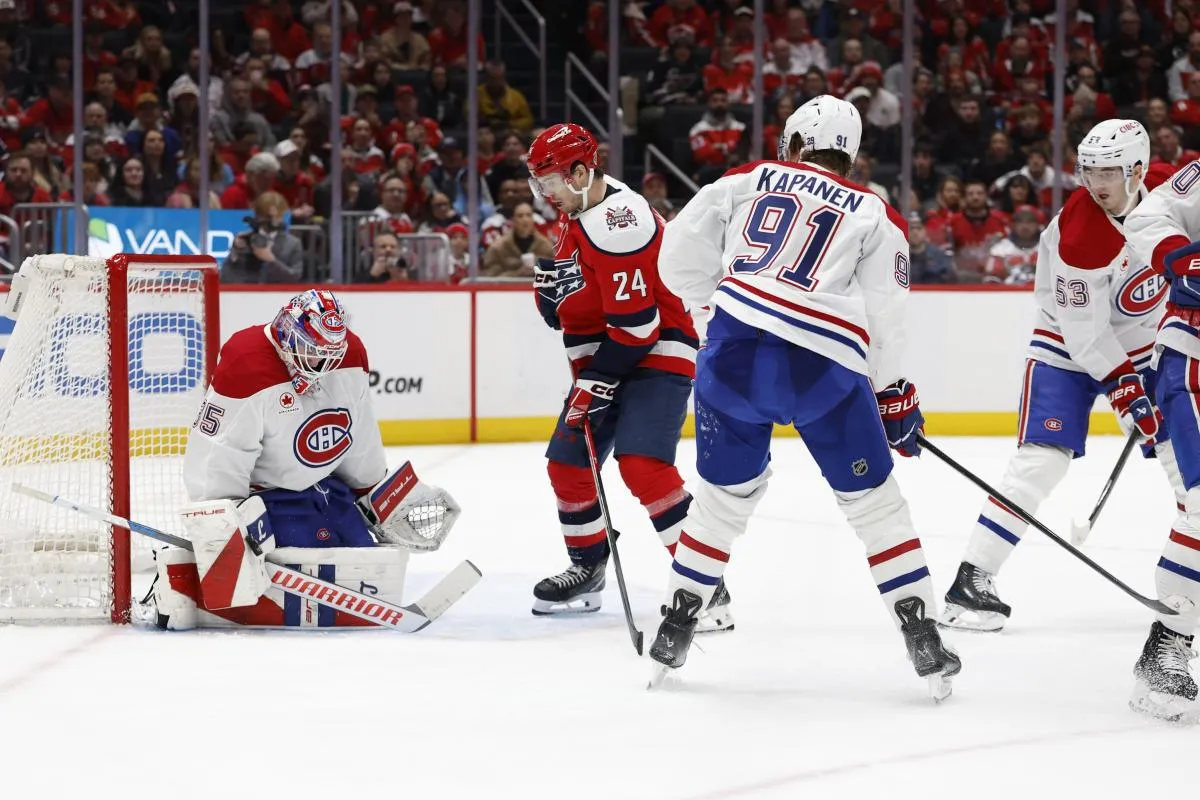 Montr&eacute;al Canadiens goaltender Samuel Montembeault (35) makes a save in front of Washington Capitals center Connor McMichael (24) during the third period at Capital One Arena.