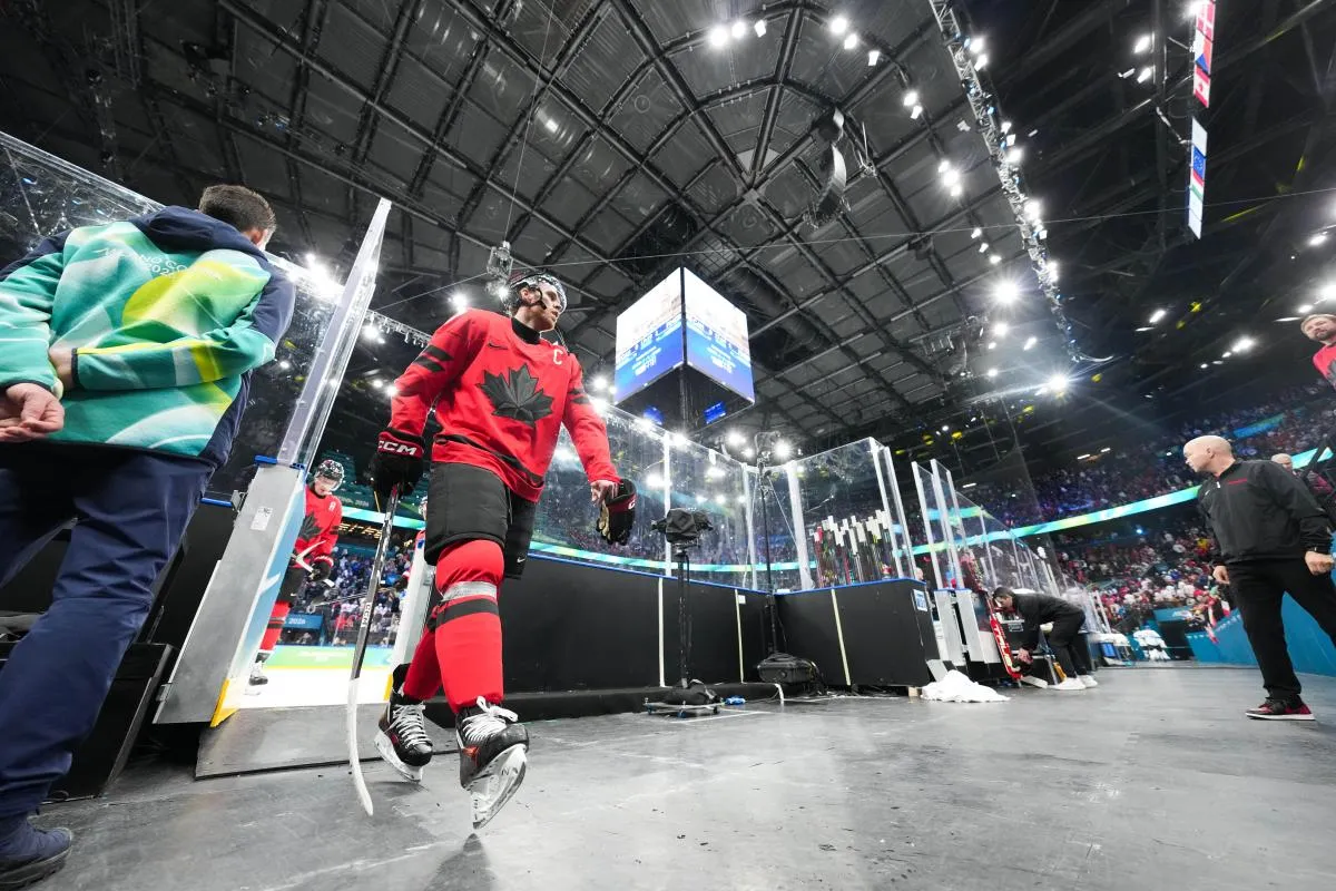 Connor McDavid (97) of Canada leaves the ice after the first period against Finland in a men's ice hockey semifinal during the Milano Cortina 2026 Olympic Winter Games at Milano Santagiulia Ice Hockey Arena.
