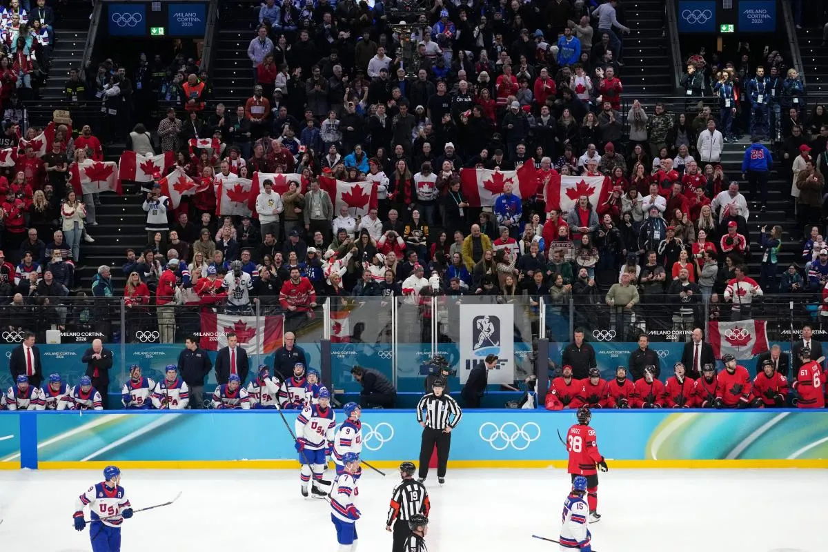 A general view of Canada fans behind the team benches during the men's ice hockey gold medal game during the Milano Cortina 2026 Olympic Winter Games at Milano Santagiulia Ice Hockey Arena.