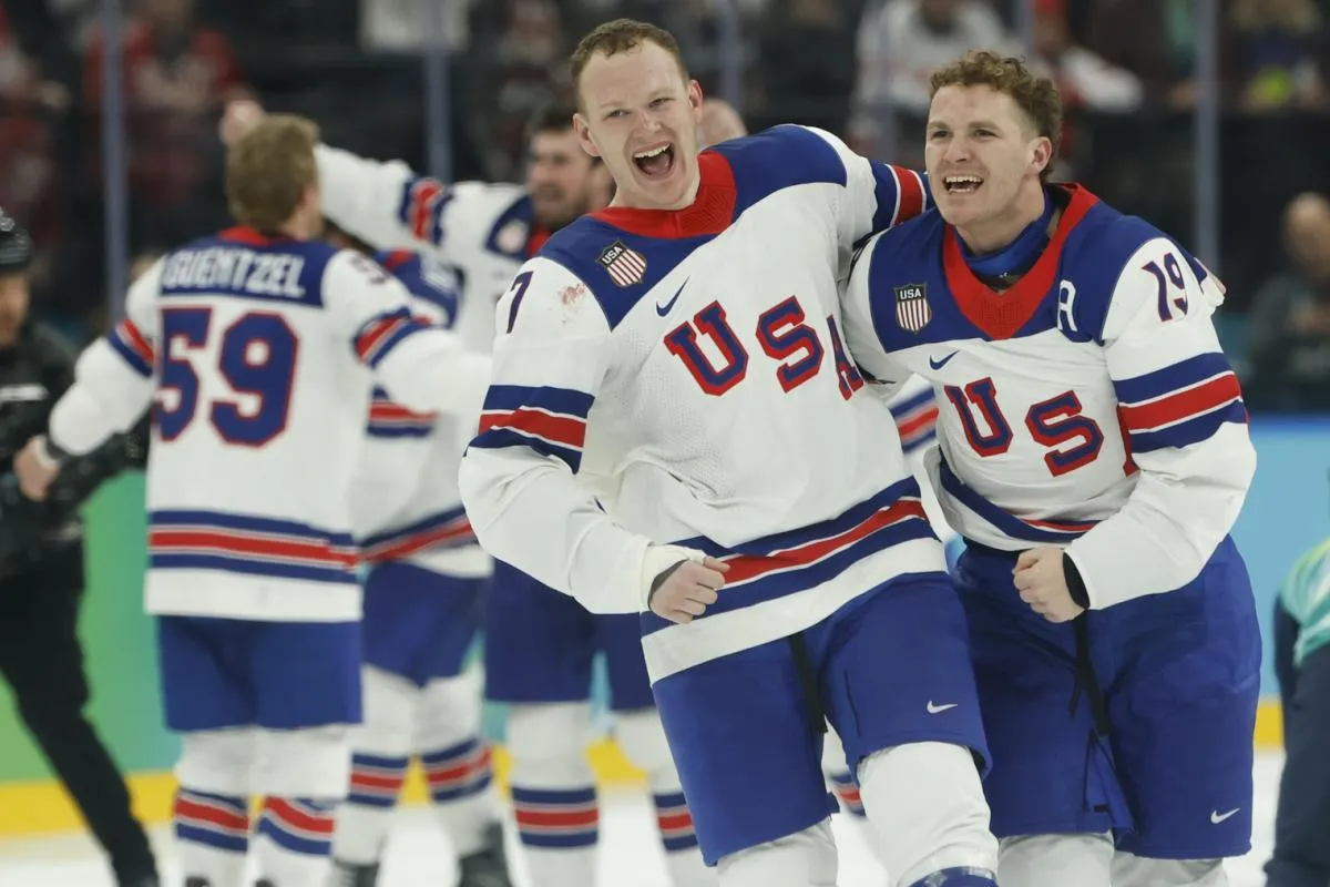 Brady Tkachuk #7 of Team United States and Matthew Tkachuk #19 of Team United States celebrate after their game against Team Canada during the Milano Cortina 2026 Olympic Winter Games at Milano Santagiulia Ice Hockey Arena.
