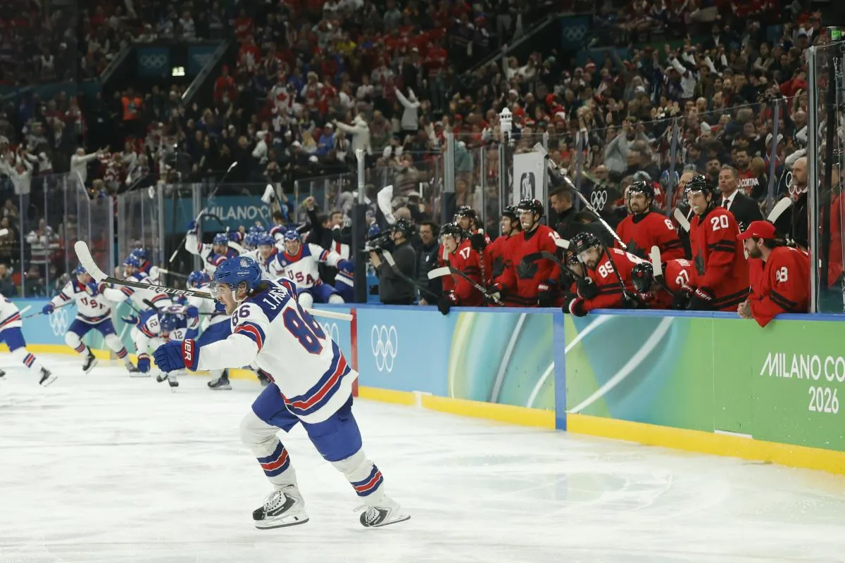 Jack Hughes #86 of Team United States celebrates after scoring the golden goal in overtime against Team Canada during the Milano Cortina 2026 Olympic Winter Games at Milano Santagiulia Ice Hockey Arena.