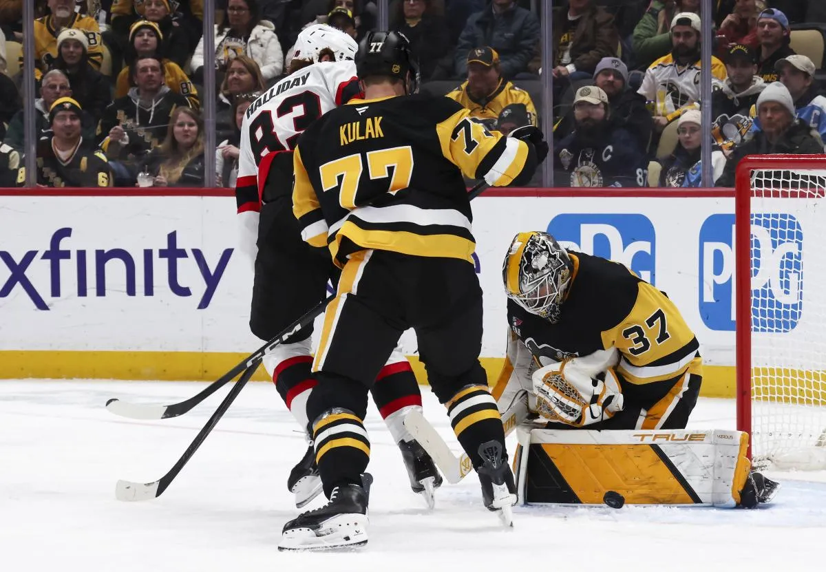 Pittsburgh Penguins goaltender Arturs Silovs (37) makes a save against Ottawa Senators center Stephen Halliday (83) as Pens defenseman Brett Kulak (77) defends during the second period at PPG Paints Arena.